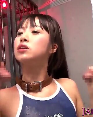 Tiny Japanese in swimsuit bukkaked after sucking cock